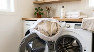 The Ultimate Hoodie Lifestyle Magazine 7 Alo sweatshirt inside mesh laundry wash bag on washing machine